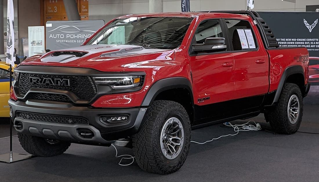 A heavy-duty pickup parked with a trailer coupled behind it