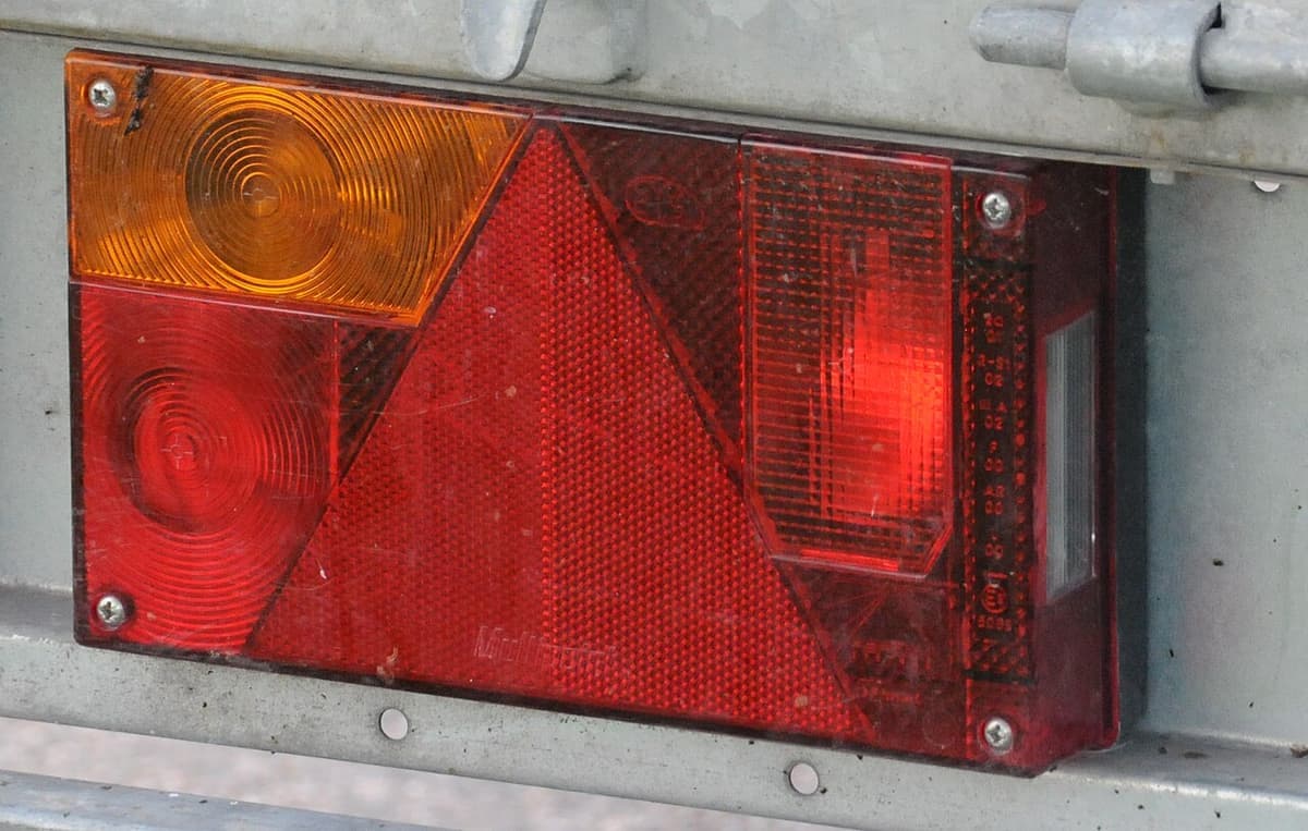 A trailer tail light and reflector assembly viewed close up