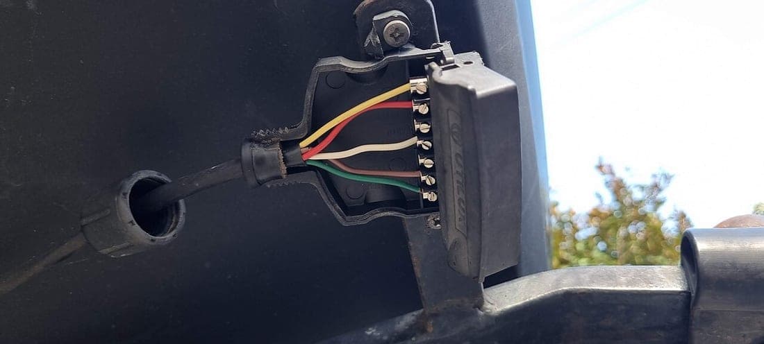 A 7-pin trailer socket opened up showing its wire terminals